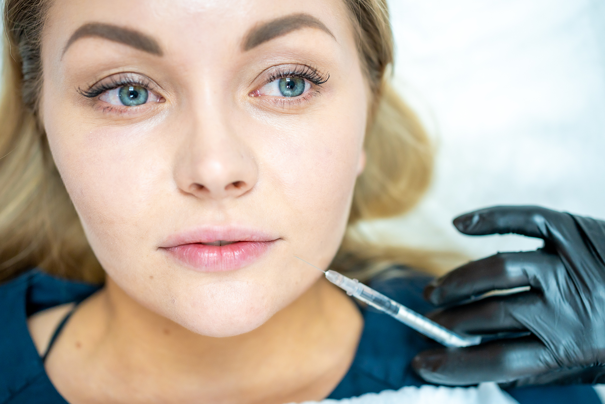 image of a woman doing botox